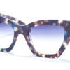 Ana Hickmann AH 9388 G21 sunglasses featuring oversized square frames with a distinctive tortoiseshell pattern in shades of blue and brown, complemented by blue gradient lenses and a stylishly twisted temple design.