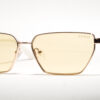 "Guess GU 00106 21E 59 sunglasses with gold hexagonal frames, yellow lenses, and white temples."