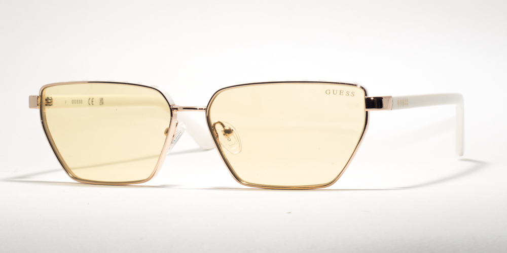 "Guess GU 00106 21E 59 sunglasses with gold hexagonal frames, yellow lenses, and white temples."