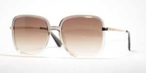 Max & Co MO 0083 20F 56 sunglasses with oversized square frames that fade from cream to transparent, brown gradient lenses, and delicate gold accents on the hinges
