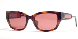 Max & Co MO 0086 52S 54 sunglasses with medium-sized oval frames in a glossy amber tortoiseshell finish, pink gradient lenses, and subtle branding on the temples.