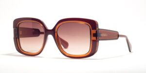 Max & Co MO 0096 50F 52 sunglasses with large square frames in a rich amber color, brown gradient lenses, and the brand name 'MAX&Co.' embossed in a matching tone on the temples.