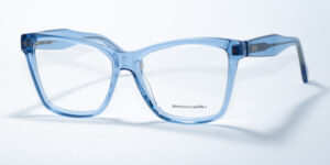 Rebecca Blu 7609 prescription glasses featuring a modern, square frame design in a transparent light blue color. These frames provide a fresh and contemporary look, with subtle RB branding on the temples for a stylish, yet understated touch.