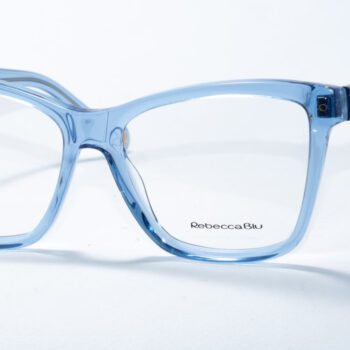 Rebecca Blu 7609 prescription glasses featuring a modern, square frame design in a transparent light blue color. These frames provide a fresh and contemporary look, with subtle RB branding on the temples for a stylish, yet understated touch.