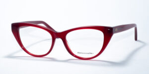 Rebecca Blu 7612 prescription glasses showcasing an elegant cat-eye frame in a bold, deep red color. This design exudes a chic, vintage-inspired vibe, perfect for adding a touch of sophistication to any look. The RB logo is subtly displayed on the temples, enhancing the stylish appeal.