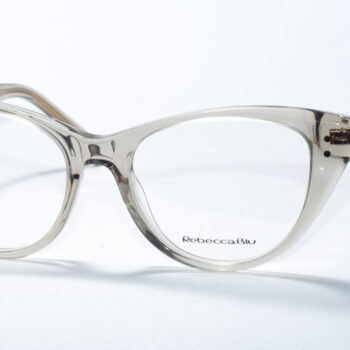 Rebecca Blu 7629 prescription glasses featuring a sophisticated cat-eye frame in a translucent taupe color. The design provides a subtle and elegant aesthetic, perfect for a chic and understated look. The RB logo is delicately placed on the temples, adding a touch of brand identity.