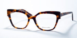 Rebecca Blu 7642 prescription glasses showcasing a bold cat-eye frame in a classic tortoiseshell pattern. These frames blend a vintage-inspired silhouette with a contemporary twist, making them a stylish choice for a standout look. The RB logo is elegantly placed on the temples, offering a refined touch of branding.