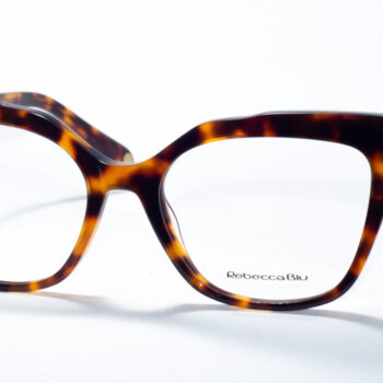 Rebecca Blu 7642 prescription glasses showcasing a bold cat-eye frame in a classic tortoiseshell pattern. These frames blend a vintage-inspired silhouette with a contemporary twist, making them a stylish choice for a standout look. The RB logo is elegantly placed on the temples, offering a refined touch of branding.